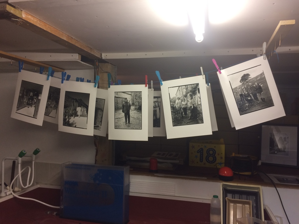 A few of the black and white portraits of the farmers drying in Rob's darkroom.